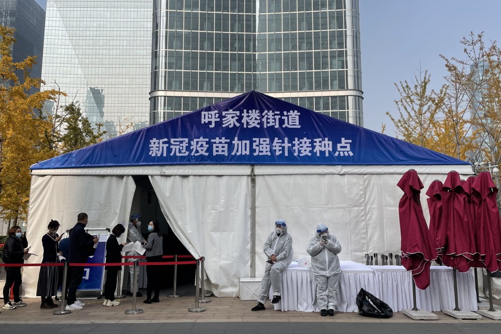 People line up to take the booster shot of the Covid-19 vaccination at a temporary vaccination centre in Beijing, China, on November 3. Photo: Simon Song