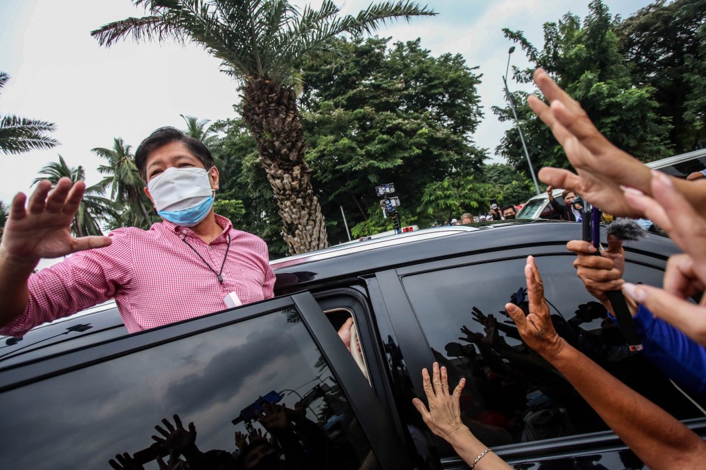 Former Philippine senator Ferdinand ‘Bongbong’ Marcos Jnr waves at supporters after filing his candidacy for the 2022 presidential race. Photo: AFP