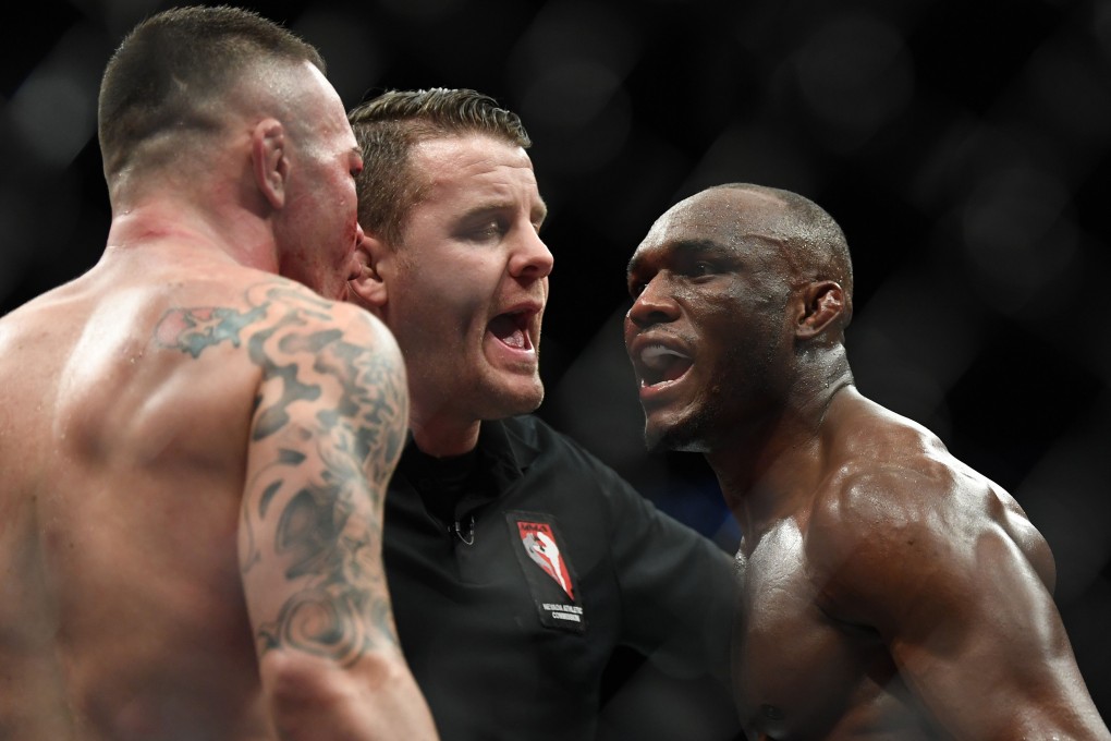 Kamaru Usman (right) and Colby Covington are separated by referee Marc Goddard during the UFC 245 main event at T-Mobile Arena. Photo: USA Today