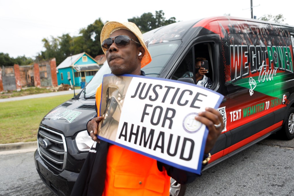 A person holds a sign as protesters demand justice for Ahmaud Arbery in Brunswick, Georgia, on Thursday. Photo: Reuters