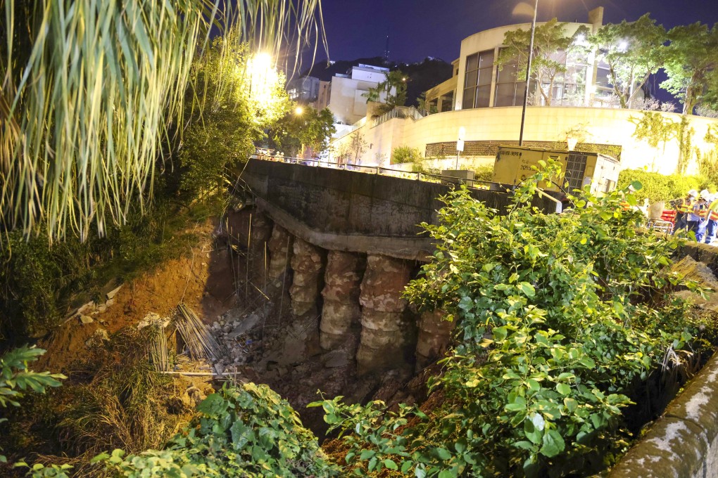 Repair works between Peak Road and Coombe Road are still in progress on Saturday after an underground water pipe burst and caused a landslide. Photo: May Tse