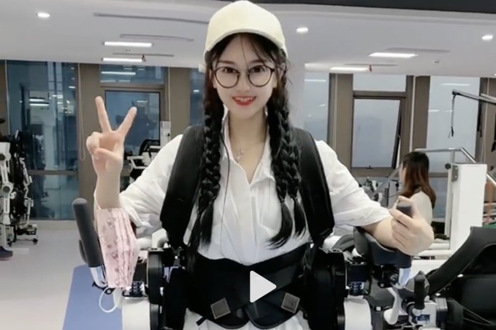 Duoduo, a paraplegic poses with an exoskeleton technology that helps her walk. Photo: Weibo
