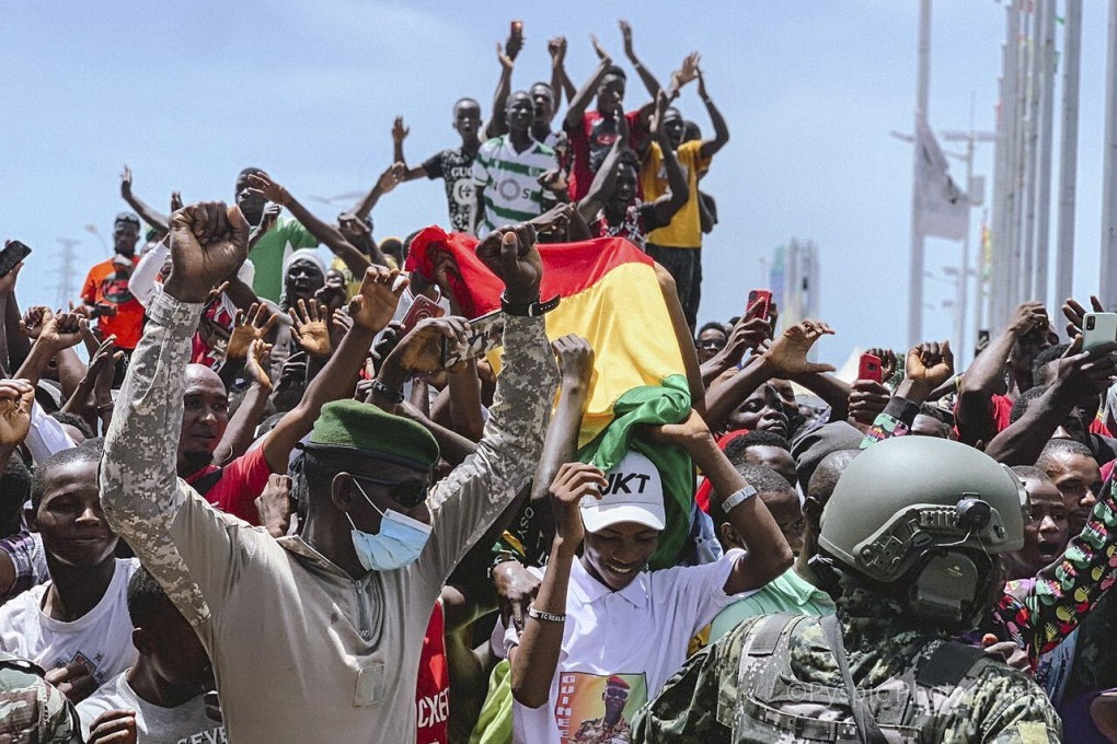 Guinean special forces celebrate with Guineans after detaining Guinean president Alpha Conde in September. Photo: EPA-EFE/STR