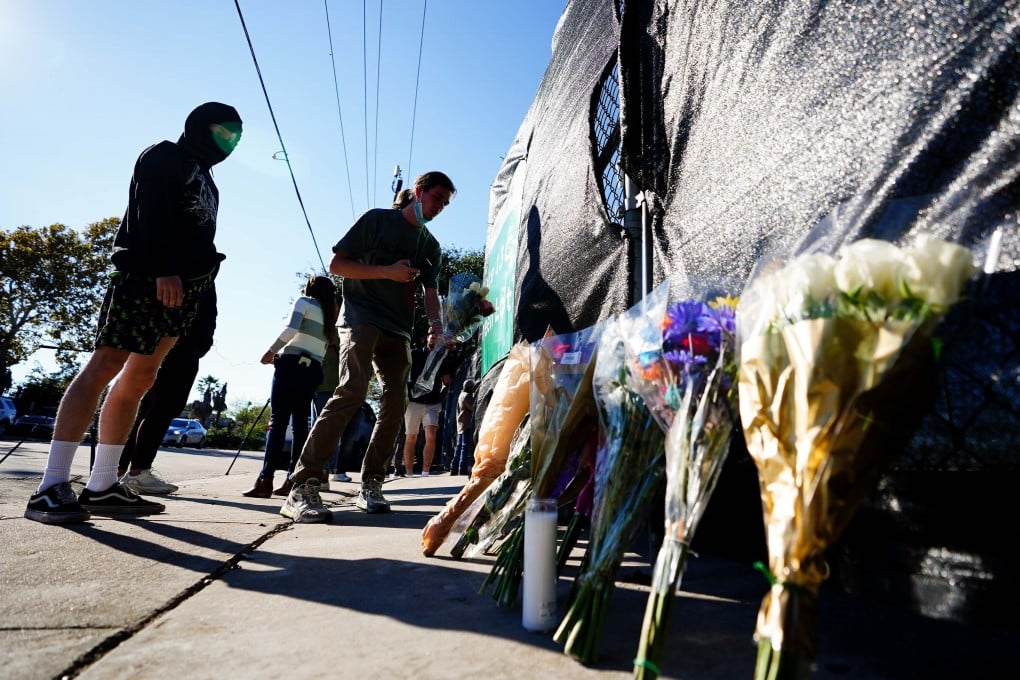 Mourners lay flowers outside the cancelled Astroworld festival after at least eight people died in a crowd surge. Photo: Getty Images/AFP