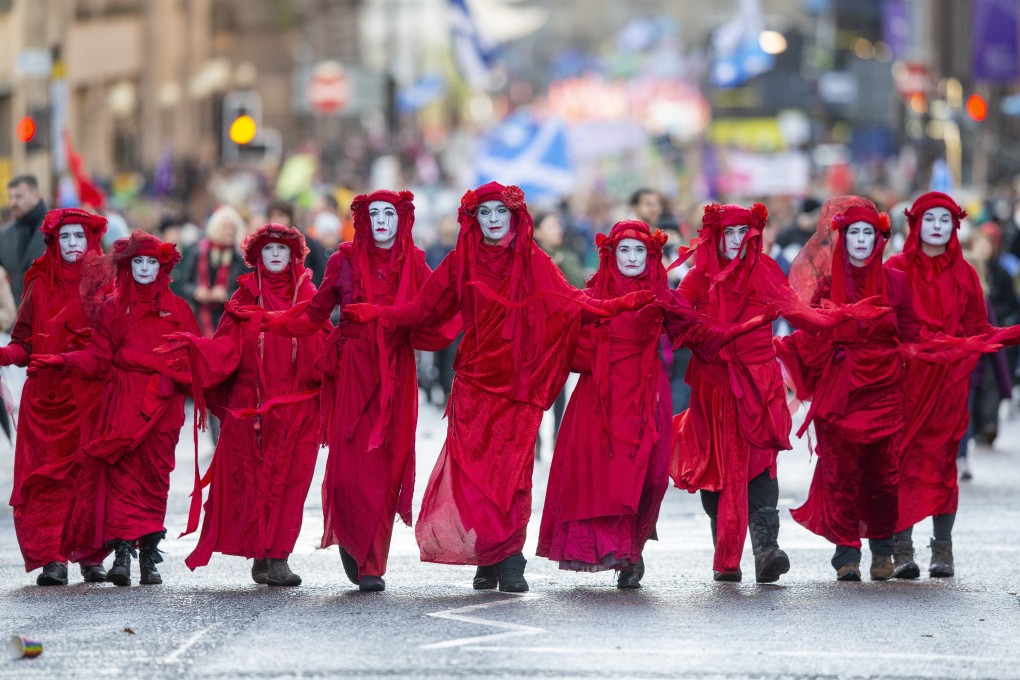 Extinction Rebellion activists march to demand action to combat climate change during the COP26 UN Climate Change Conference taking place in Glasgow, Scotland on Saturday. Photo: EPA-EFE