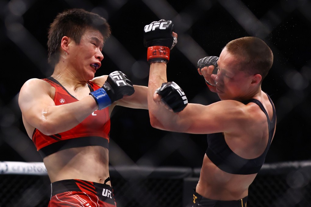 Rose Namajunas punches Zhang Weili in their strawweight title bout at UFC 268. Photo: AFP