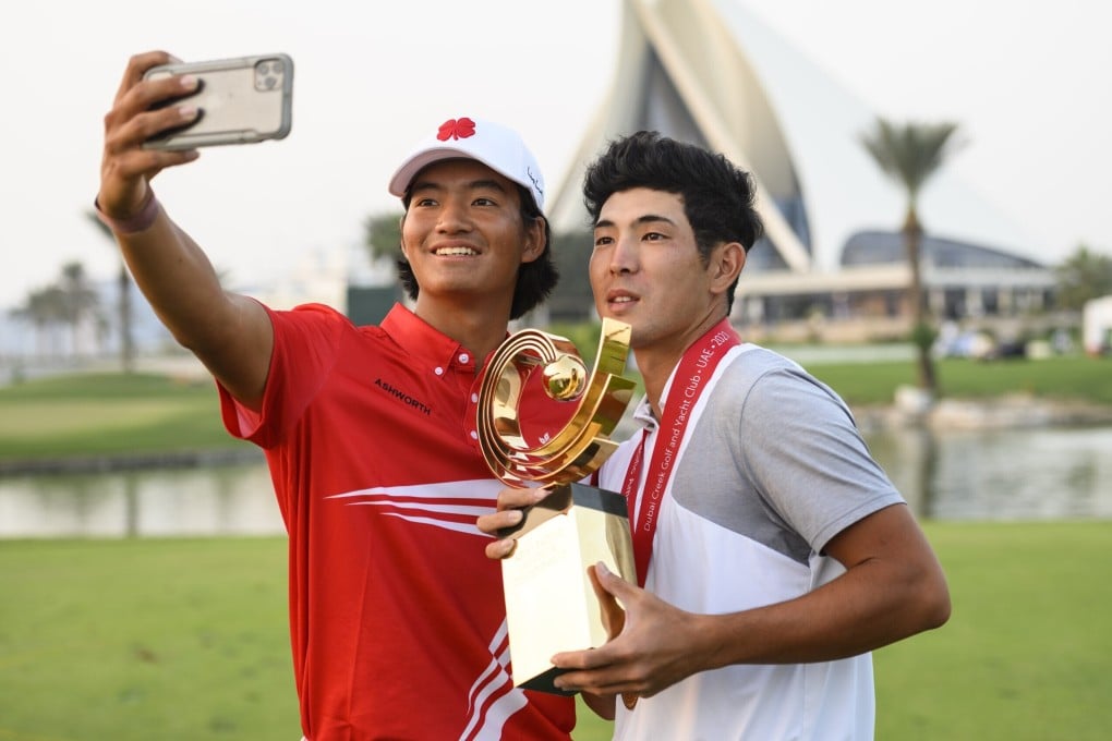 Runner up Taichi Kho of Hong Kong takes a selfie with winner Keita Nakajima of Japan and the AAC trophy after the 2021 Asia-Pacific Amateur Championship at the Dubai Creek Golf and Yacht Club. Photograph: AAC