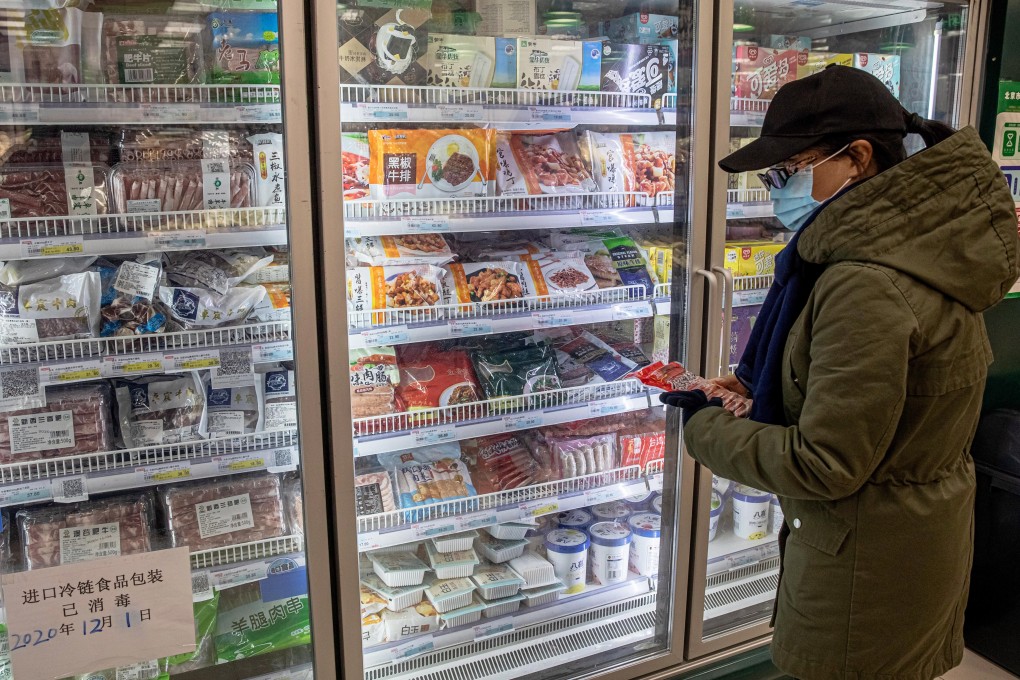 A shopper looks at imported frozen food at a store in Beijing. File photo: EPA-EFE
