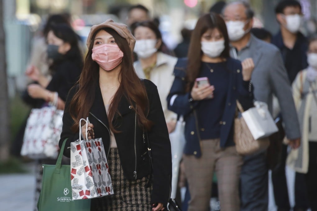 People seen at the Ginza shopping district in Tokyo. Photo: AP
