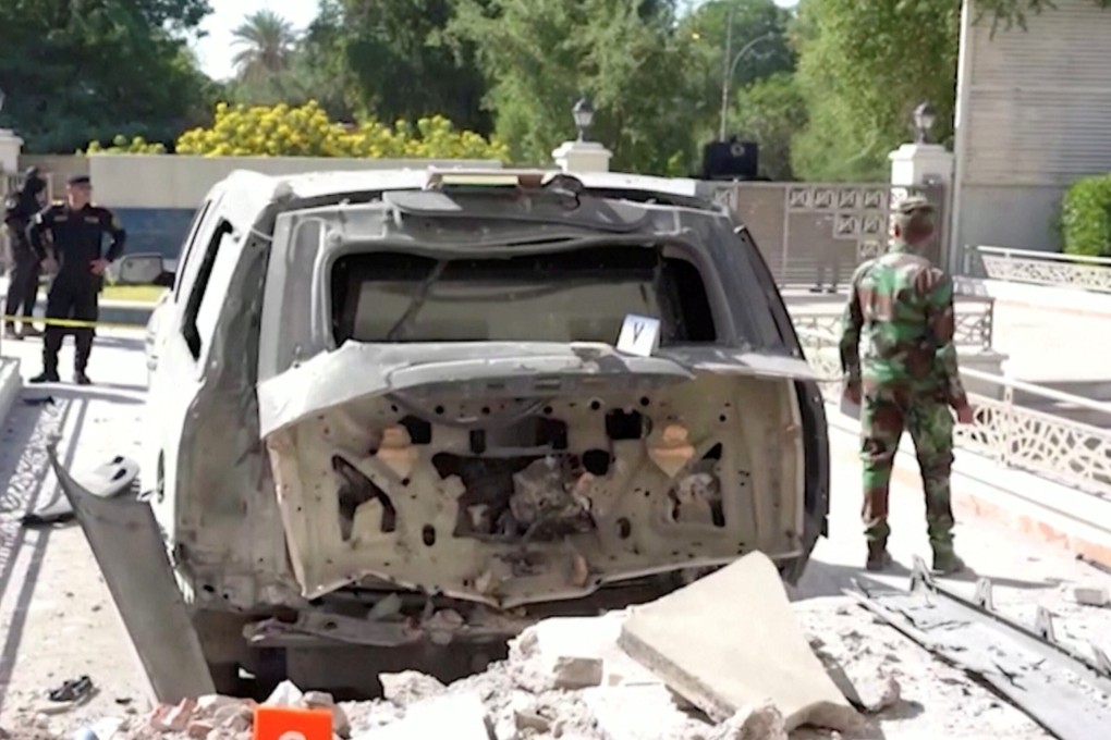 A destroyed vehicle in front of Iraqi Prime Minister Mustafa al-Kadhimi's residence after the assassination attempt by an armed drone in Baghdad. Photo: Reuters