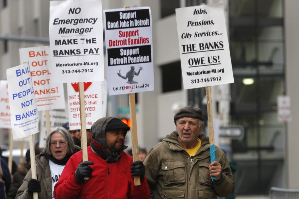 Protesters rally outside the Detroit Federal Court House on December 3, 2013, during a bankruptcy hearing declaring Detroit is eligible for the biggest municipal bankruptcy in US history. Photo: Reuters.