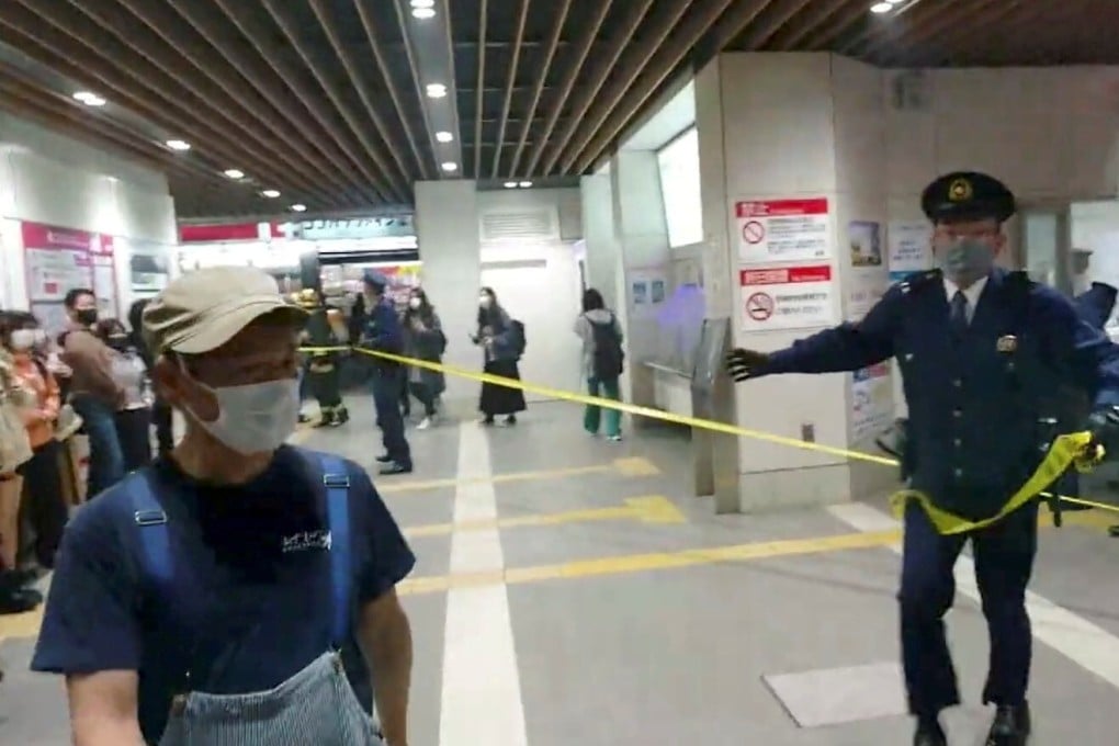 Police cordon off an area of a Tokyo train station following a knife and arson attack on October 31. Photo: Twitter/@siz33 via Reuters