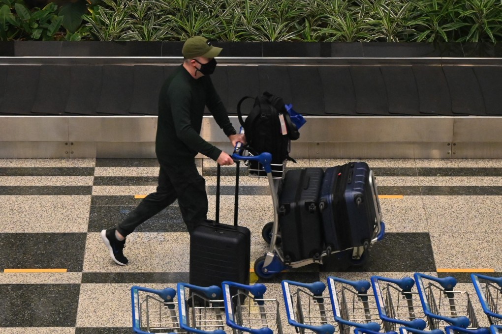 A passenger on a Singapore Airlines flight arrives in Changi Airport under a vaccinated travel lane scheme. Photo: AFP