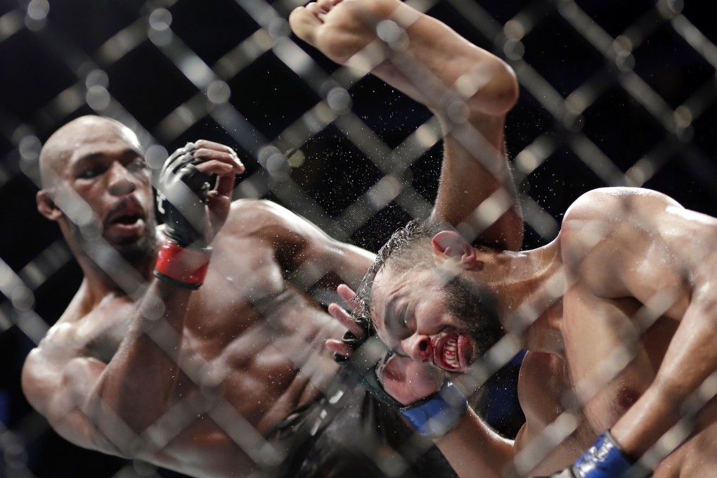 Jon Jones delivers a kick to Dominick Reyes during their light heavyweight title bout at UFC 247. Photo: AP