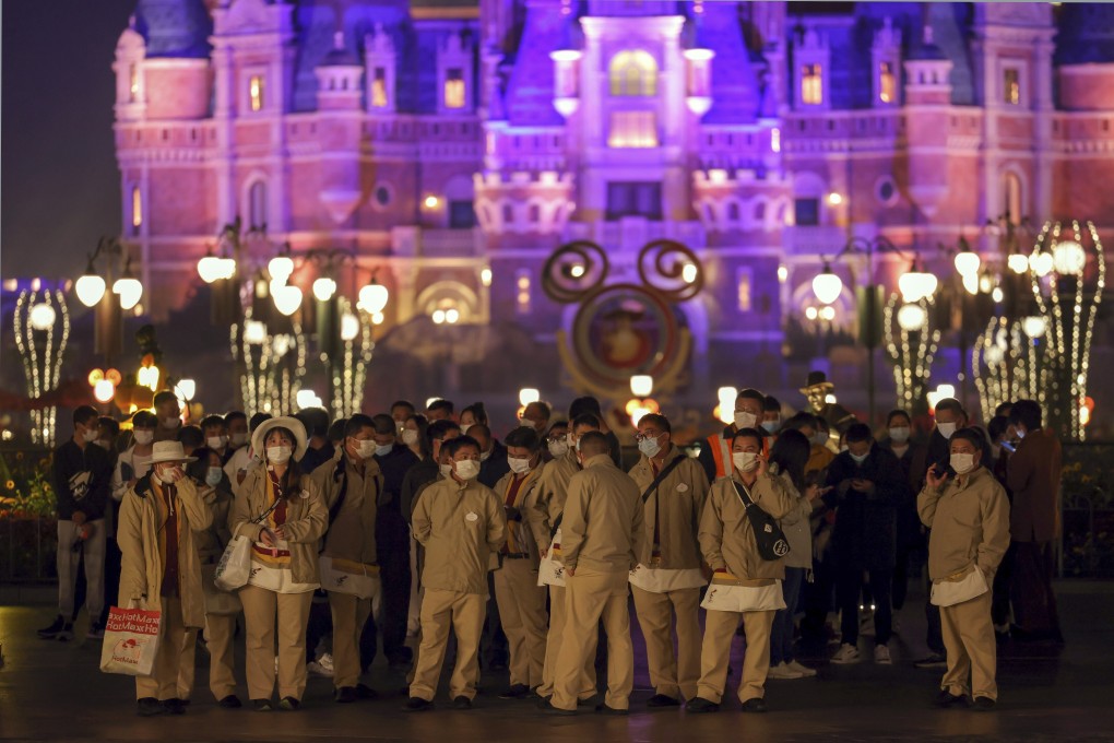 Disneyland employees wait for their Covid-19 tests at the Shanghai Disney Resort in Shanghai. Photo: AP