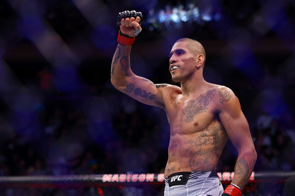 Alex Pereira celebrates after his TKO victory against Andreas Michailidis in their middleweight bout at UFC 268. Photos: AFP