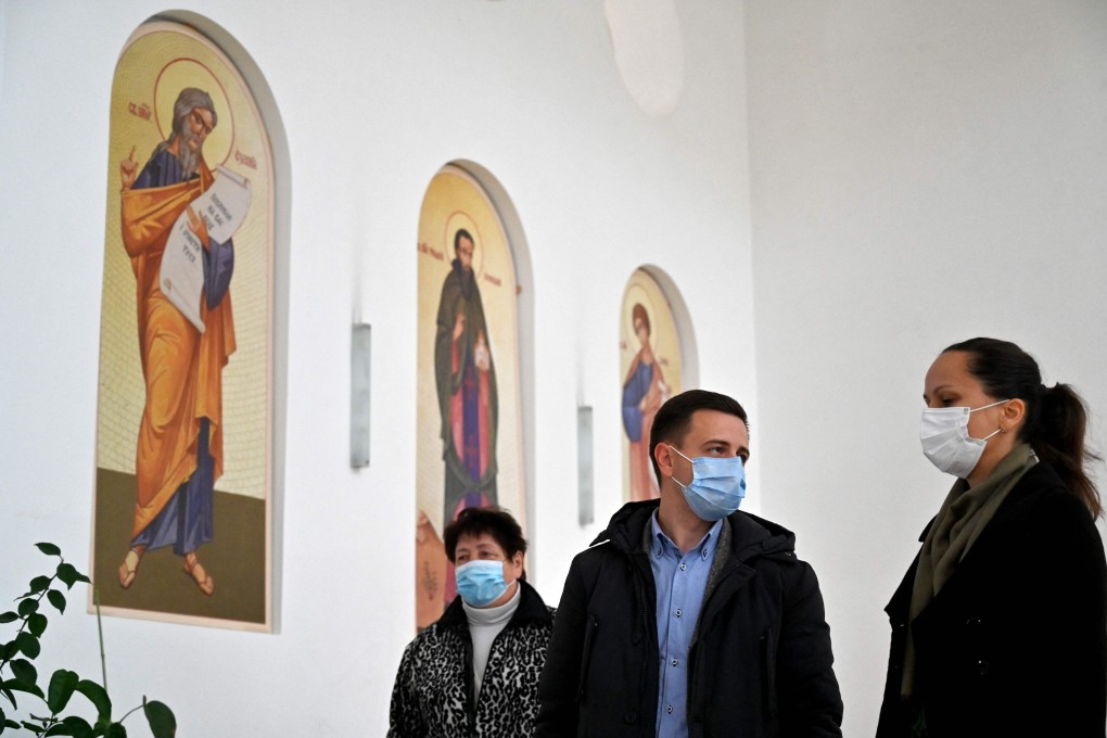 Patients queue ahead of being vaccinated against Covid-19 in a temporary vaccination centre opened in the Patriarchal Cathedral of the Ukrainian Greek Catholic Church in Kyiv on Monday. Photo: AFP