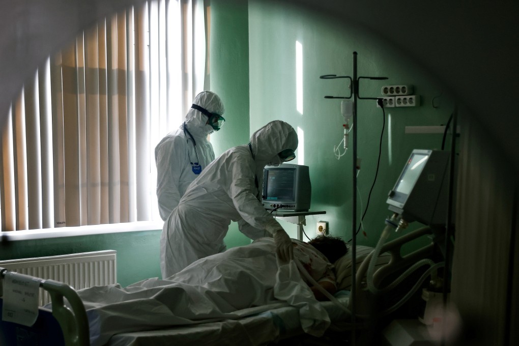 Medical specialists treat a Covid-19 patient in a hospital’s intensive care unit. Photo: Reuters