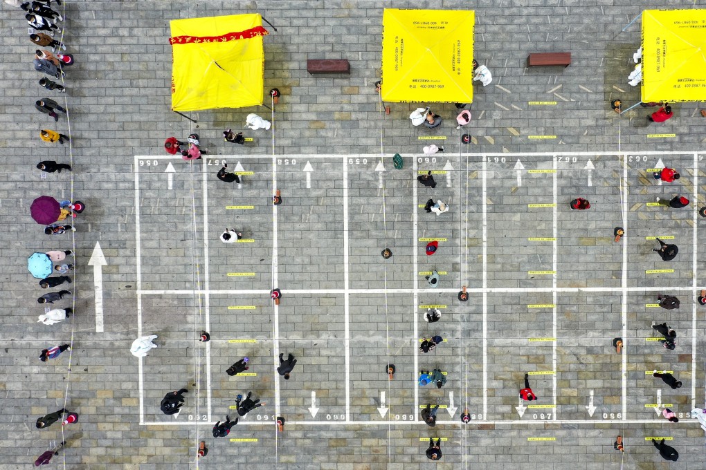 People queue for Covid-19 testing in northwest China, but a leading scientist has said determining antibody levels should be the priority. Photo: Xinhua