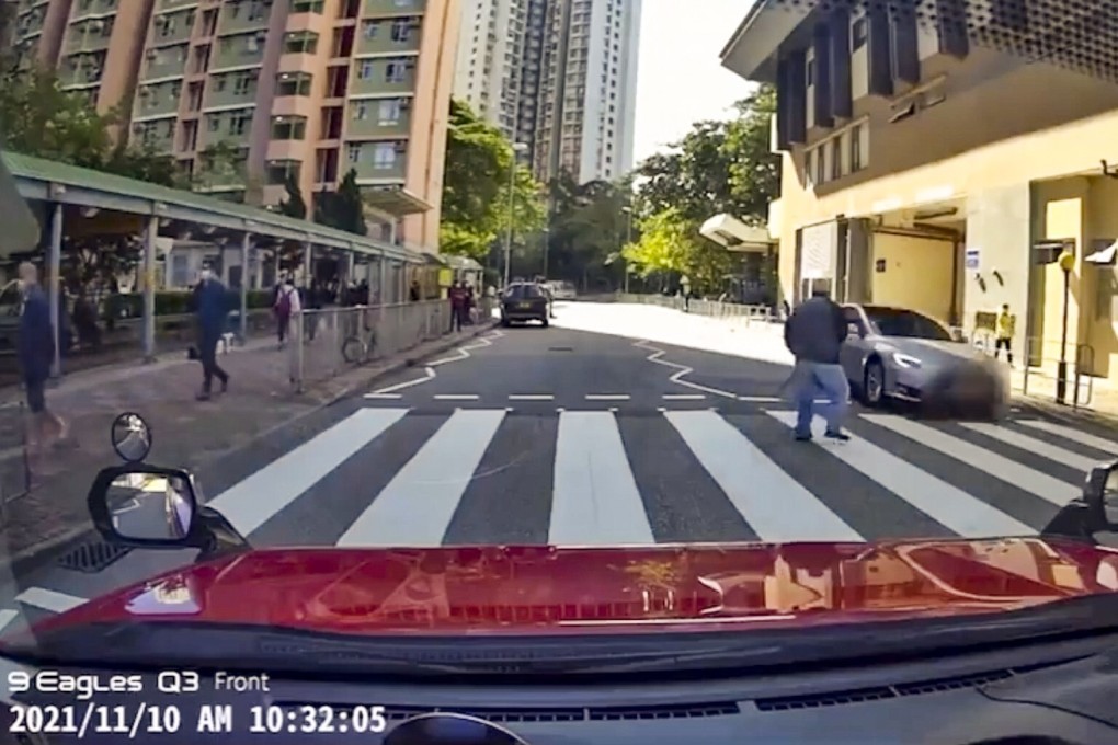 Dashcam footage shows how close a fast-moving Tesla passed by an elderly pedestrian on Wednesday. Photo: Facebook