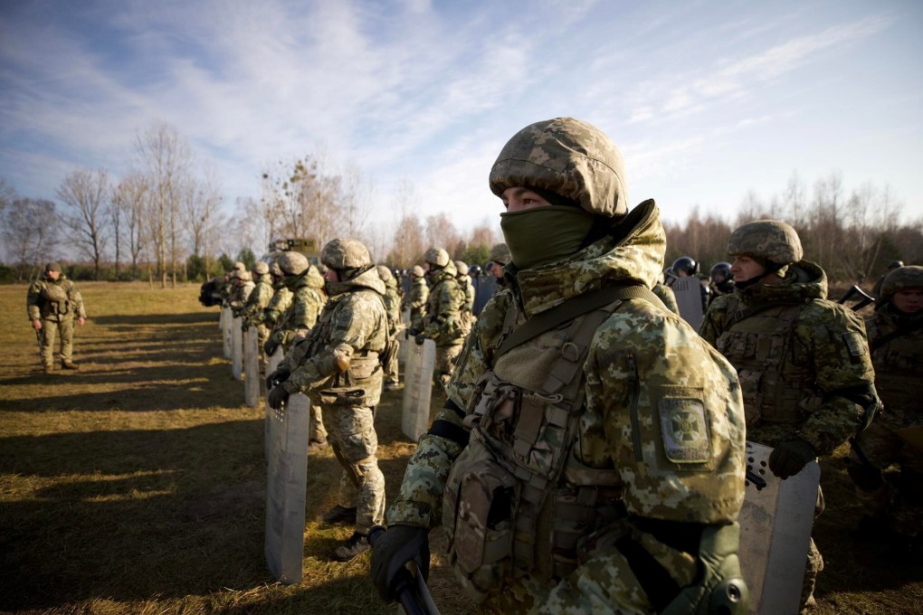 Members of the Ukrainian State Border Guard Service at the border with Belarus in Volyn region, Ukraine on Thursday. Photo: Interior Ministry of Ukraine press service via Reuters