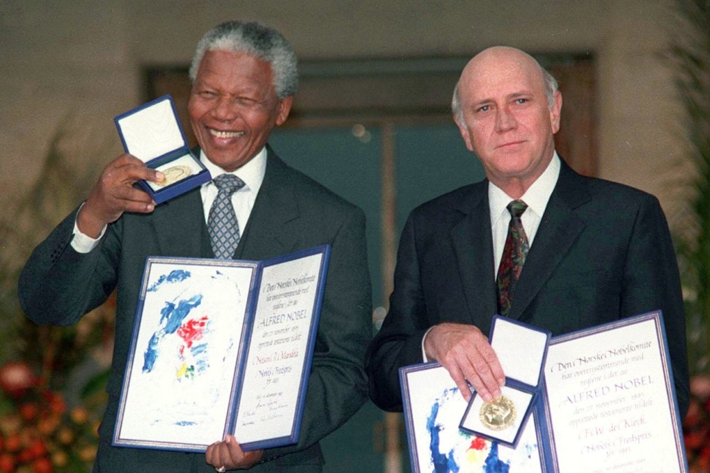 Then South African Deputy President FW de Klerk, right, and South African President Nelson Mandela pose with their Nobel Peace Prize medals in 1993. File photo: AP
