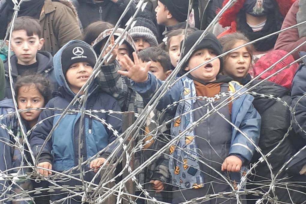Migrant children gather near the fence on the Poland/Belarus border near Kuznica, Poland. Photo: Reuters