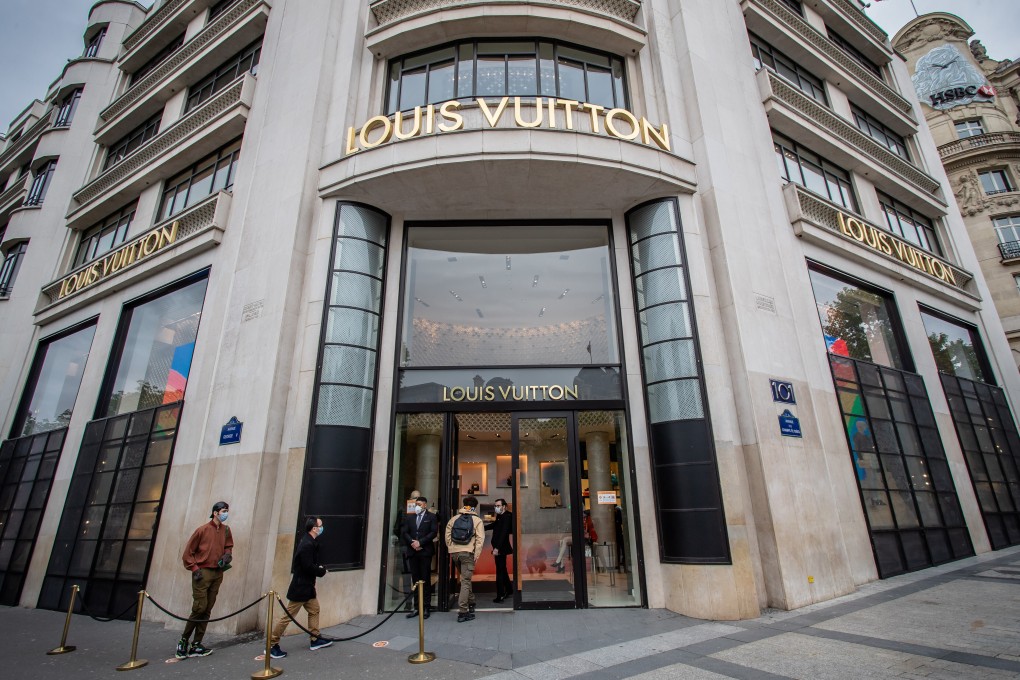 People seen outside a Louis Vuitton store on the Champs Elysees Avenue in Paris on May 11, 2020. Photo: Xinhua