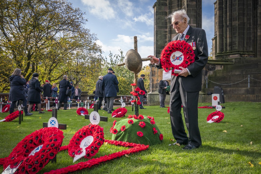 Second World War veteran James White, 96, pays his respects at the Edinburgh Garden of Remembrance in the UK. Photo: PA