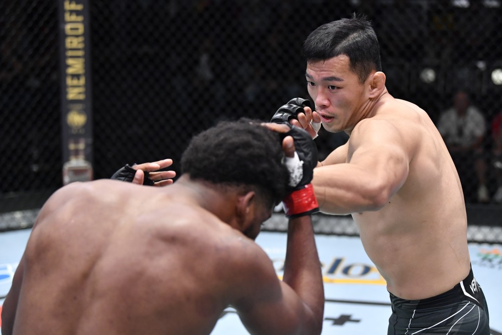 Da-un Jung punches Kennedy Nzechukwu during their light heavyweight fight in Las Vegas. Photo: Zuffa LLC