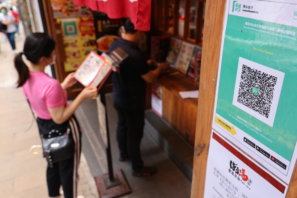 Customers are required to scan the QR code for the “Leave Home Safe” app at a restaurant in Lan Kwai Fong. Photo: May Tse