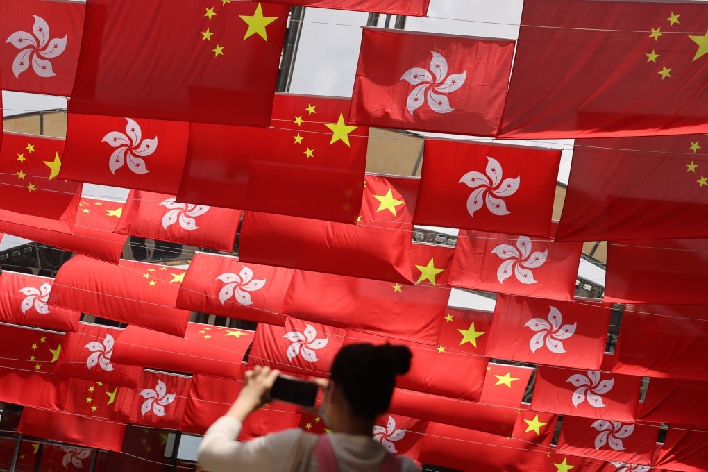 National and city flags in Hong Kong’s Tsim Sha Tsui marking the 24th anniversary of the handover. Photo: May Tse