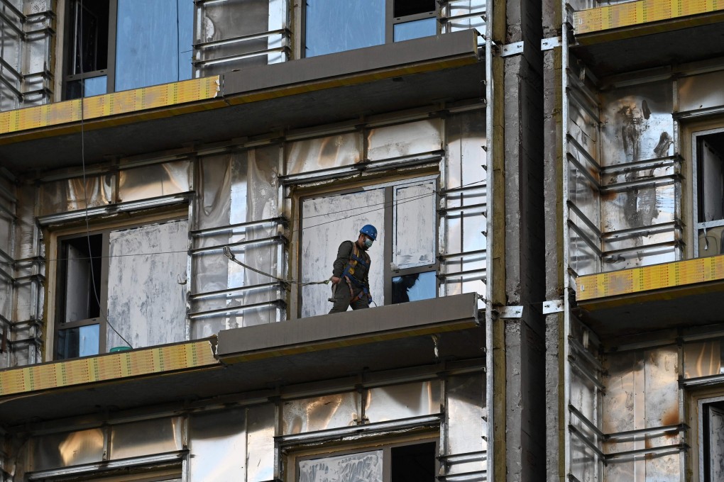 A labourer works at a construction site in Beijing. Photo: AFP