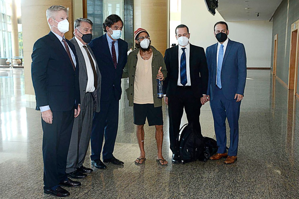 US journalist Danny Fenster (third from right) at Naypyidaw International Airport in Myanmar. Fenster, imprisoned in Myanmar since May, has been released from prison days after being sentenced to 11 years. Photo: Myanmar military via AFP