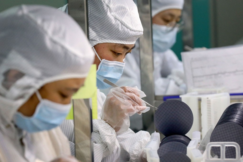 Employees make chips at a Jiejie Semiconductor Company factory in Nantong, in China's eastern Jiangsu province, on March 17. Photo: AFP