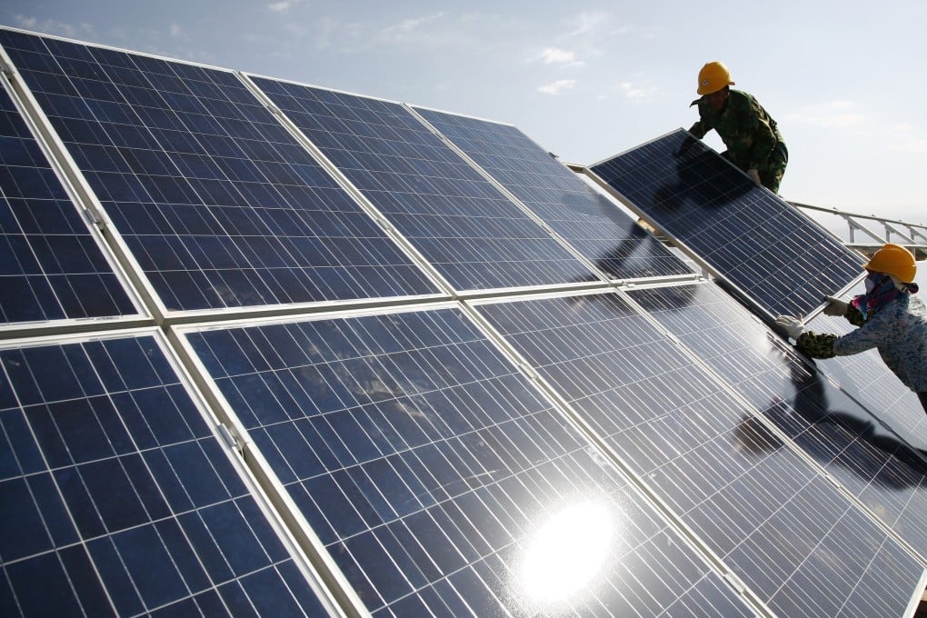 Photovoltaic panels being installed at a solar power plant. A planned new project in the Philippines would increase the country’s solar capacity by almost 50 per cent. (Photo: Chinatopix via AP