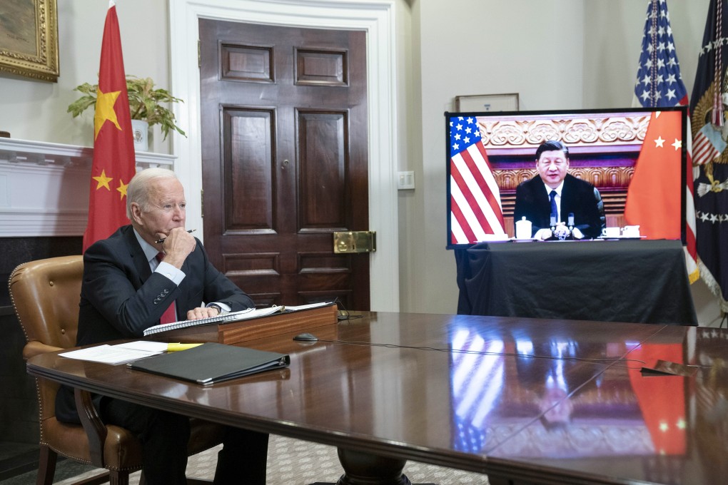 US President Joe Biden, at the White House, listens to counterpart Xi Jinping by video link from Beijing. Photo: Bloomberg