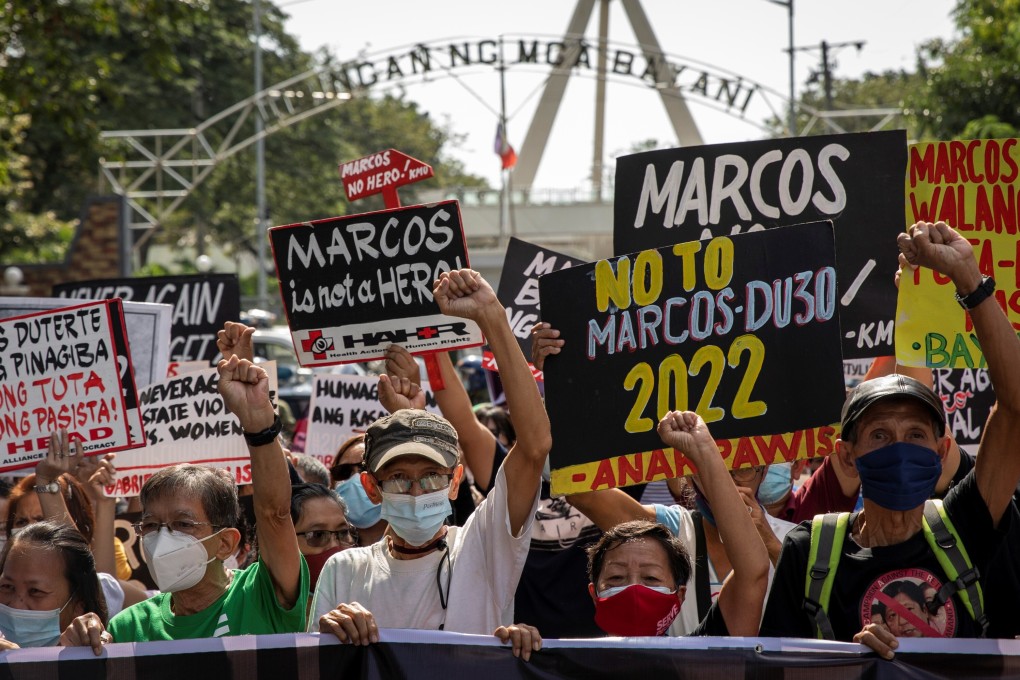 Filipino activists and martial law victims during a Thursday protest in Manila marking the anniversary of the 2016 burial, with military honours, of the dictator Ferdinand Marcos, who died in 1989. His son is an early front runner in the 2022 elections. Photo: Reuters