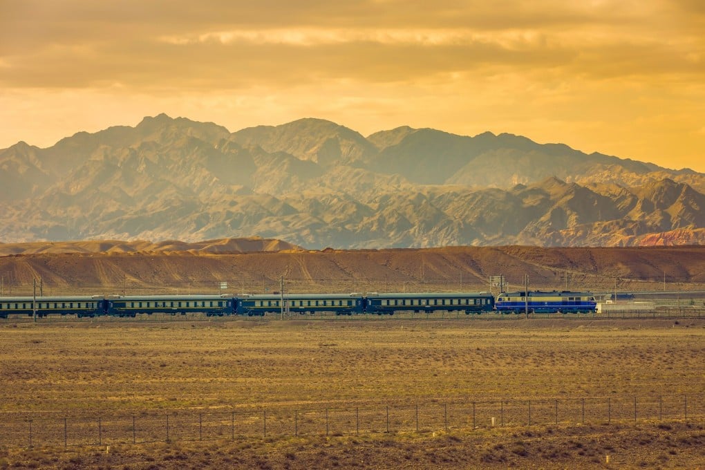 A train runs through the Gobi Desert and Qilian mountains in northwest China’s Gansu province. Photo: Handout