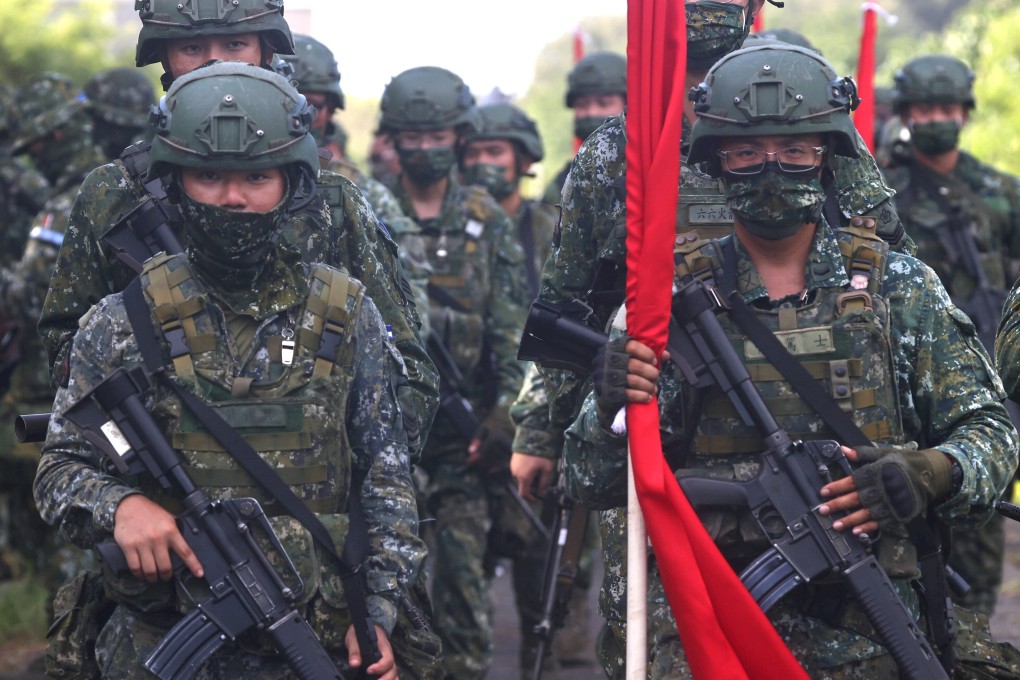 Taiwanese soldiers march into position during an anti-invasion drill on a beach in Tainan in September. Photo: Reuters