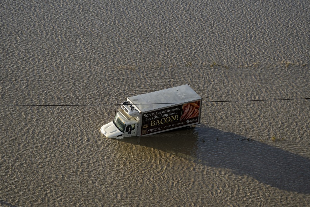 A truck stranded along a flooded road in Abbotsford, British Columbia. Photo: AP