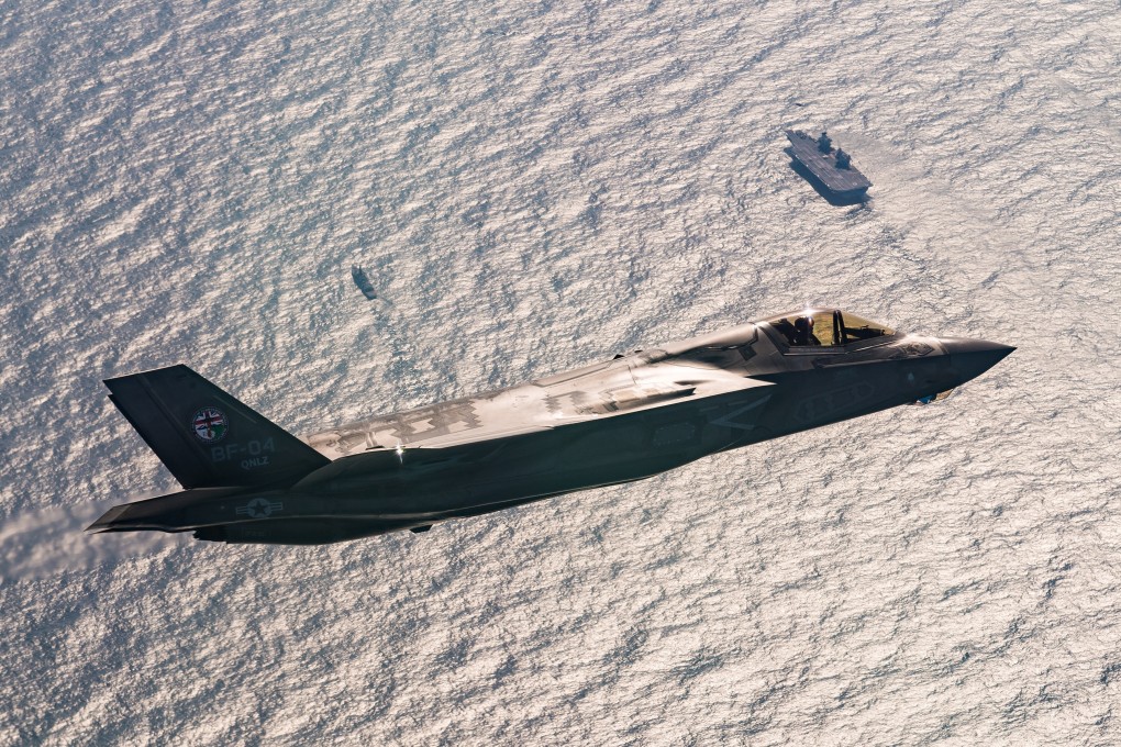 A F-35 fighter jet flying above HMS Queen Elizabeth in 2018. File photo: Lockheed Martin