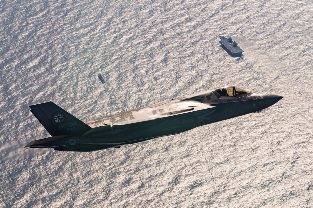 A F-35 fighter jet flying above HMS Queen Elizabeth in 2018. File photo: Lockheed Martin