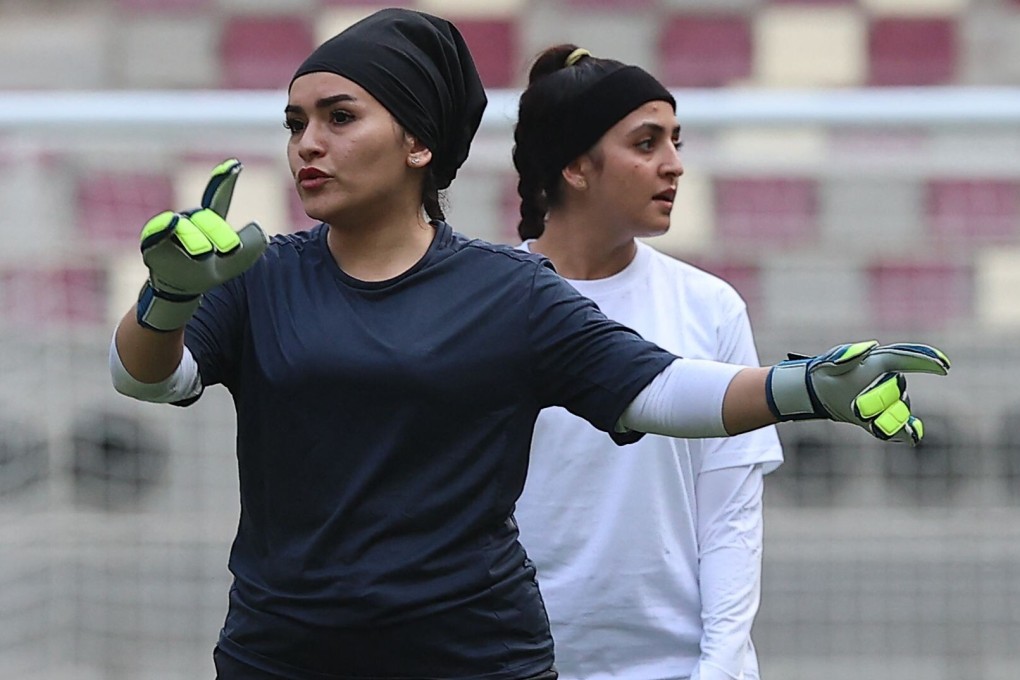 A female Afghan goalkeeper takes part in a friendly football match against Qatar women‘s national team in Doha. Many female athletes have fled Afghanistan since the Taliban took over this summer. Photo: AFP