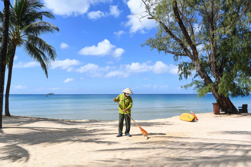 A staff member sweeps the grounds of the Vinpearl resort on Phu Quoc as the island prepares for its first international tourists. Photo: AFP