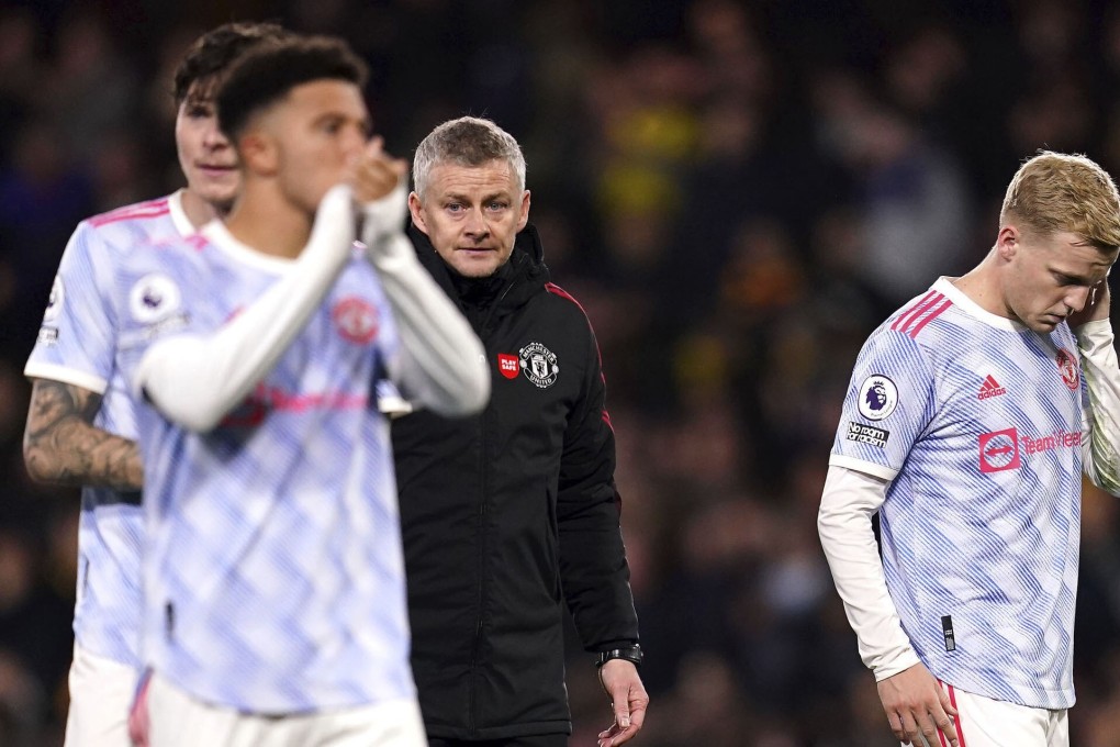Manchester United manager Ole Gunnar Solskjaer (centre) and his players look dejected after defeat by Watford. Photo: AP