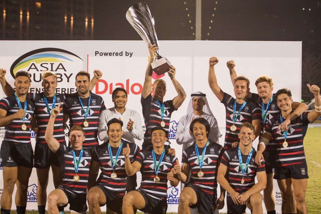Hong Kong men's rugby sevens team lift the Asia Rugby Sevens Series 2021 trophy after winning the final in Dubai and sealing a 2022 Rugby World Cup place. Photo: Asia Rugby