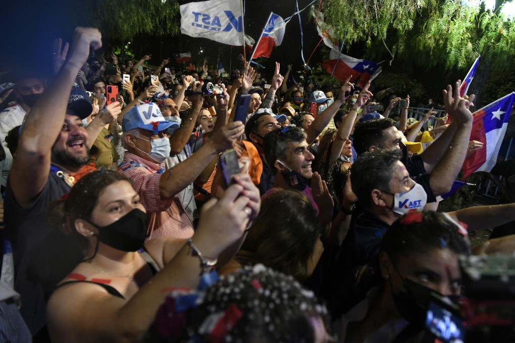 Supporters of Jose Antonio Kast, presidential candidate of the Republican Party, during an election night rally in Santiago, Chile, on Sunday. Kast and leftist rival Gabriel Boric will square off in a run-off next month, setting the stage for the most divisive election since the return of democracy in 1990. Photo: Bloomberg