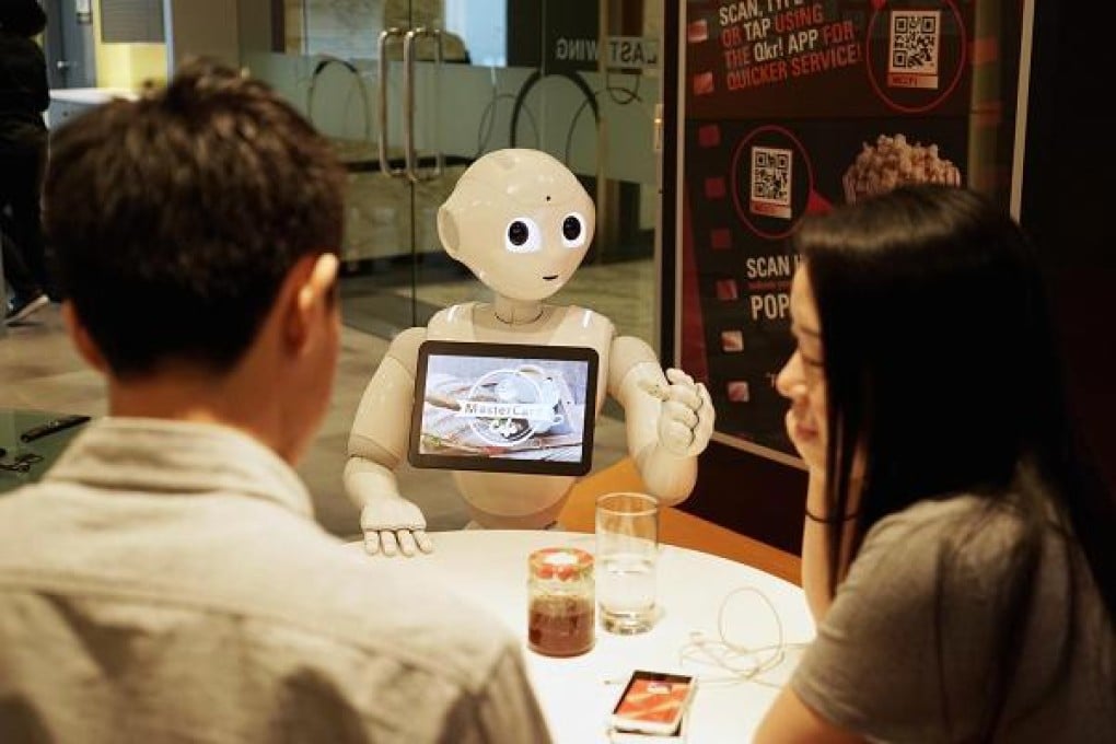 Pepper can chat with customers, make recommendations, take their orders and accept payments using MasterCard's digital payment service. Photo: MasterCard