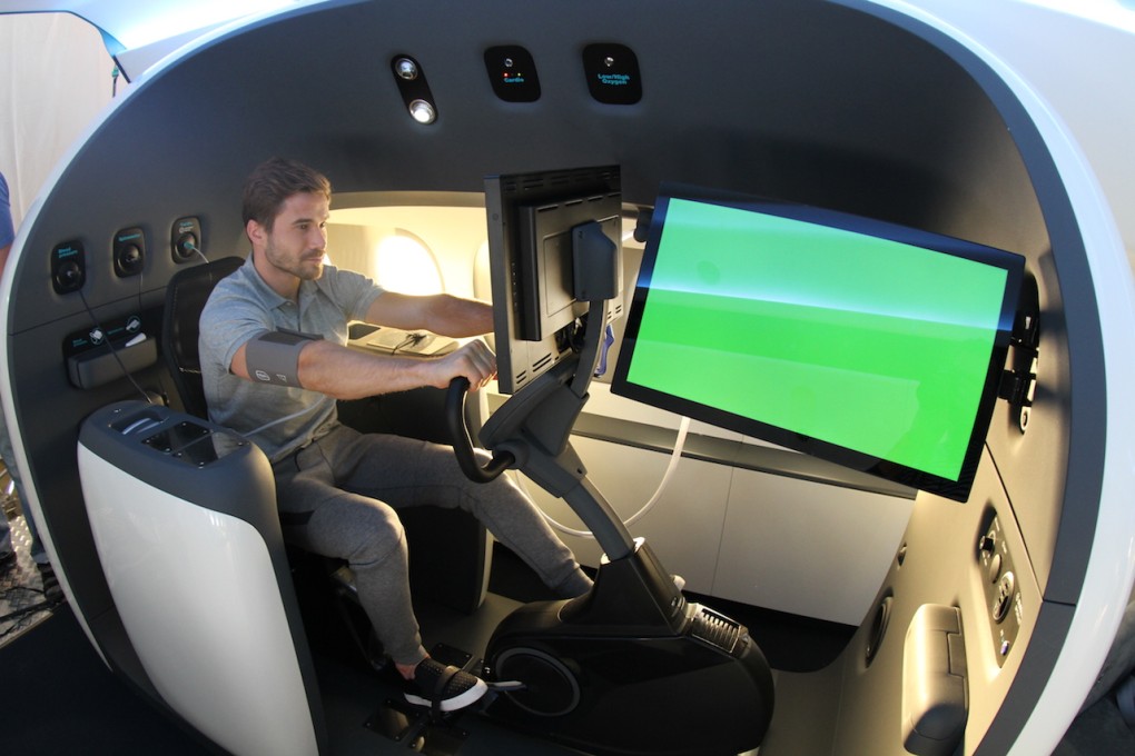 An athlete riding an exercise bike in the Sukhoi SportJet while sensors track his physiological changes. Photo: Sukhoi